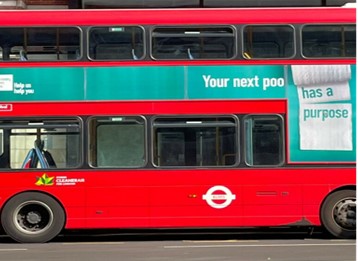 Photo of a London bus showing the NHS bowel cancer media campaign graphics which were created for the 2022 campaign in London. 