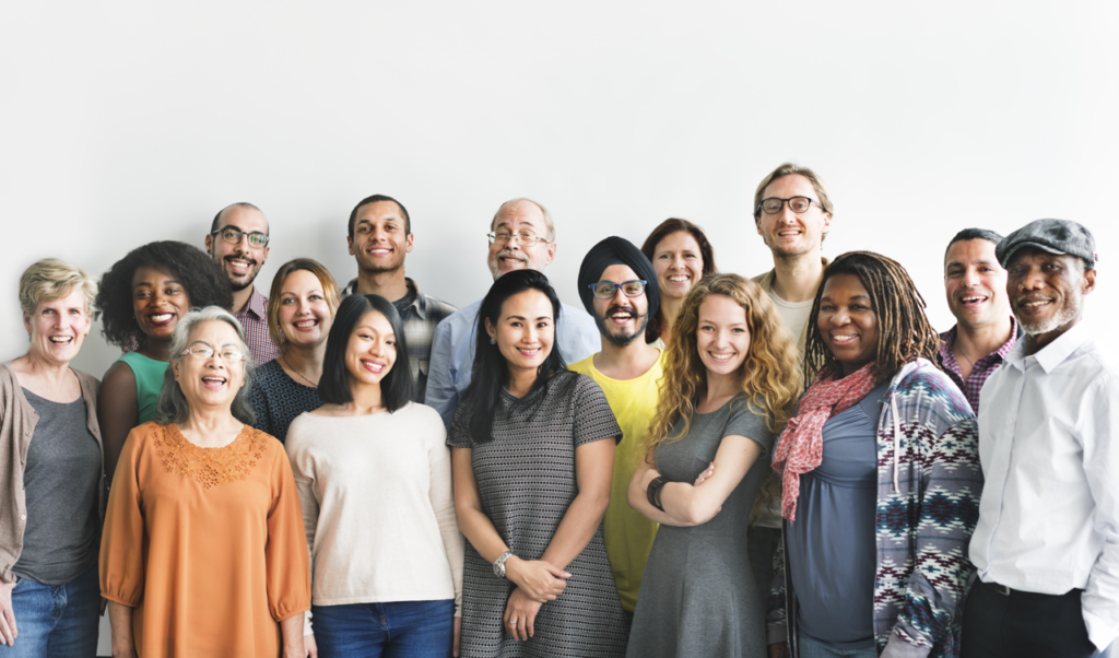 Diverse group of people of all genders smiling to camera