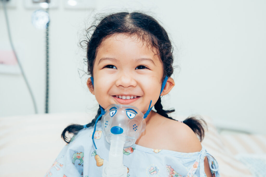 child with oxygen mask