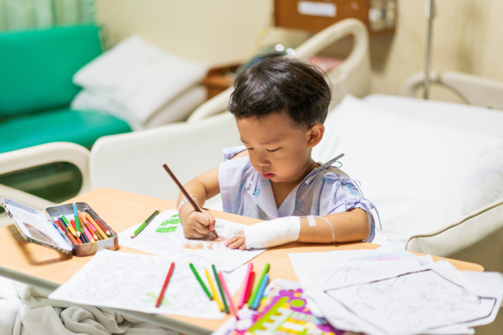 Child colouring in a picture