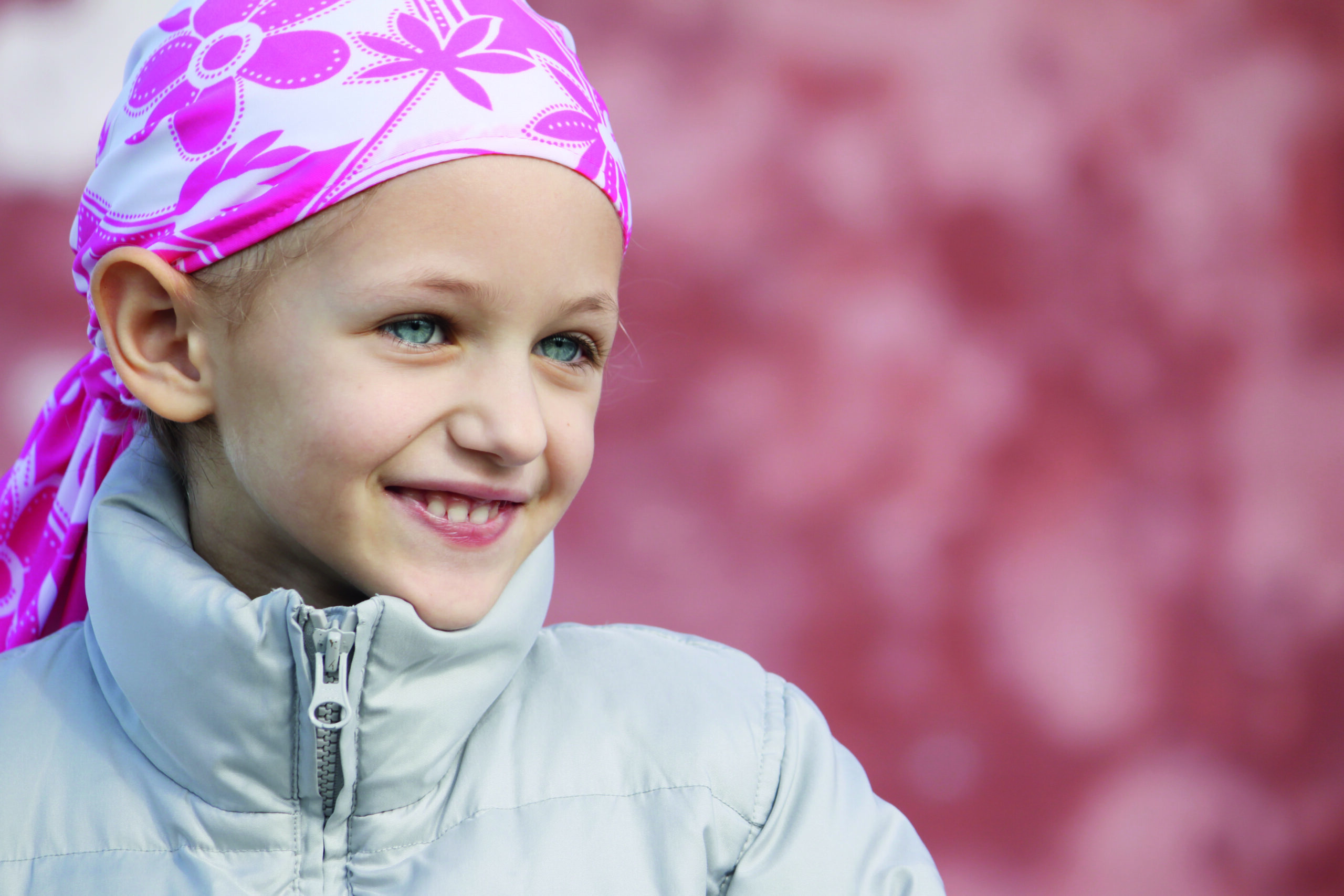 Smiling child wearing a headscarf