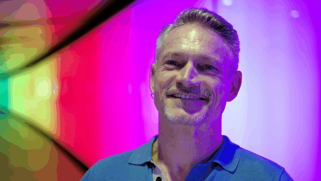 Garry Brough against a colourful background